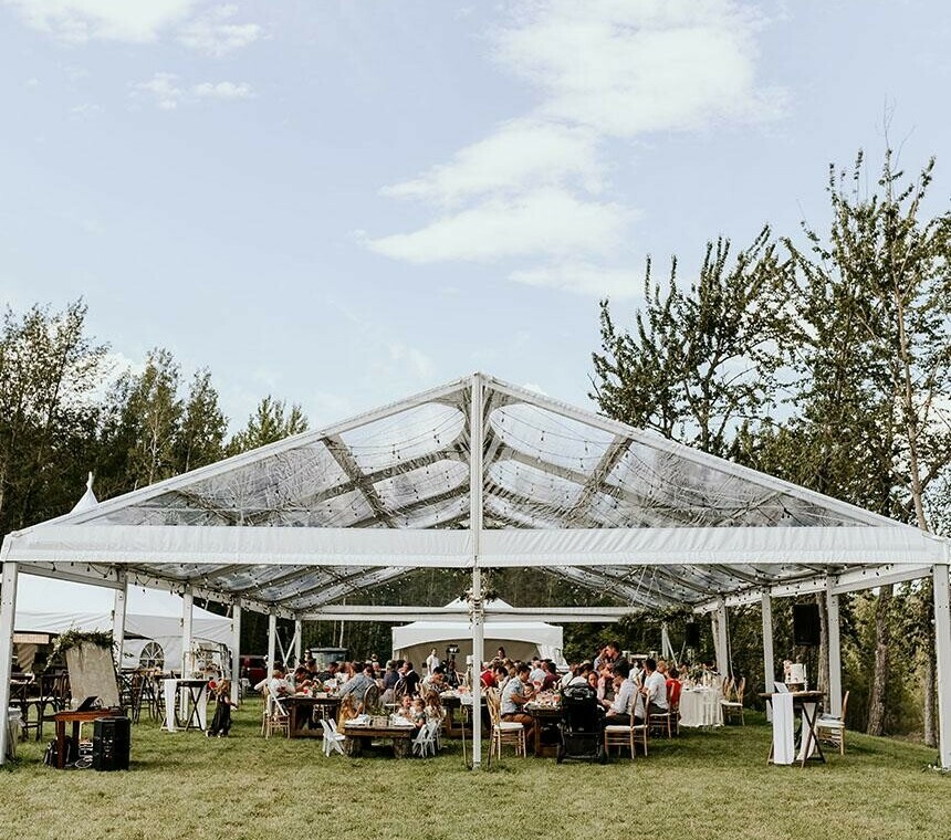 Tent Rentals Regina featuring the front side of a clear top Clearspan A-Frame Tent covering a wedding reception
